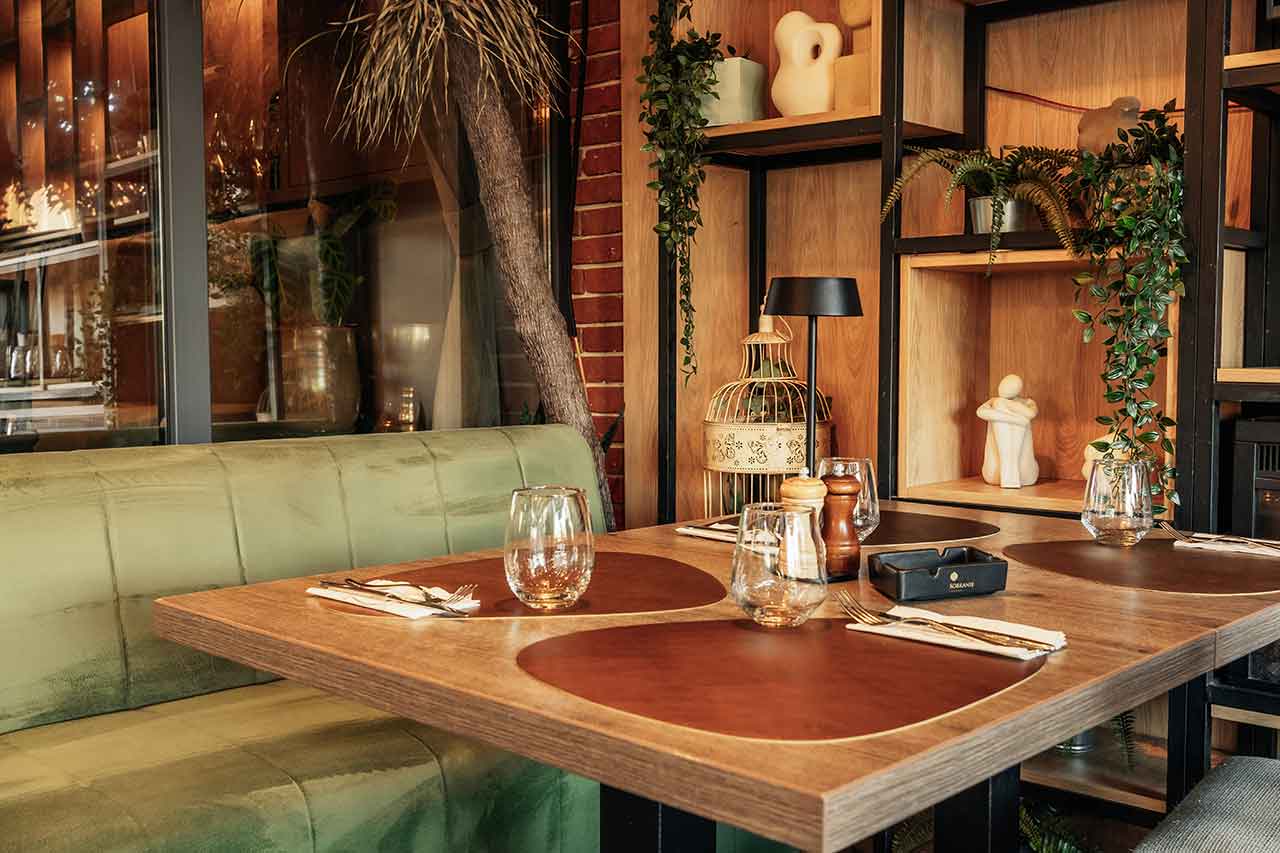 Acoustic Comfort in Restaurants: The Role of Furniture and Materials